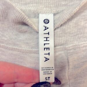 97% Modal
3% spandex

Heather gray long sleeve dress with thumb holes.